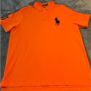 Orange Ralph Lauren Polo with a Navy colored horse classic fit size L